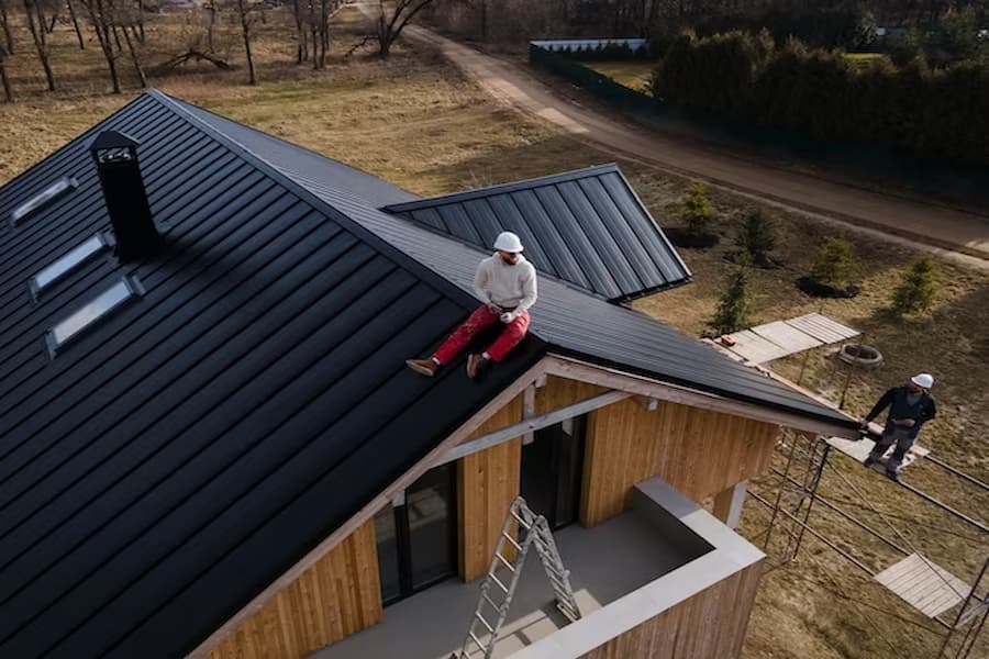 A roofer is taking rest after installing new roof
