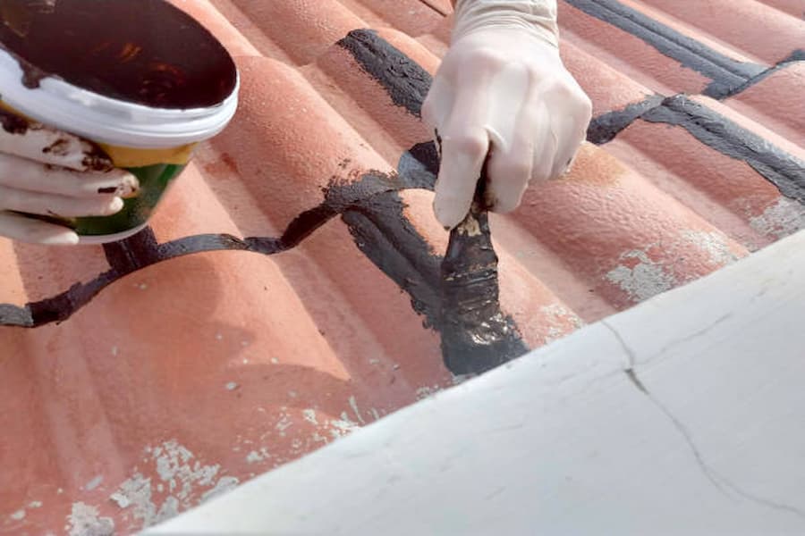apply roofing tar over nails